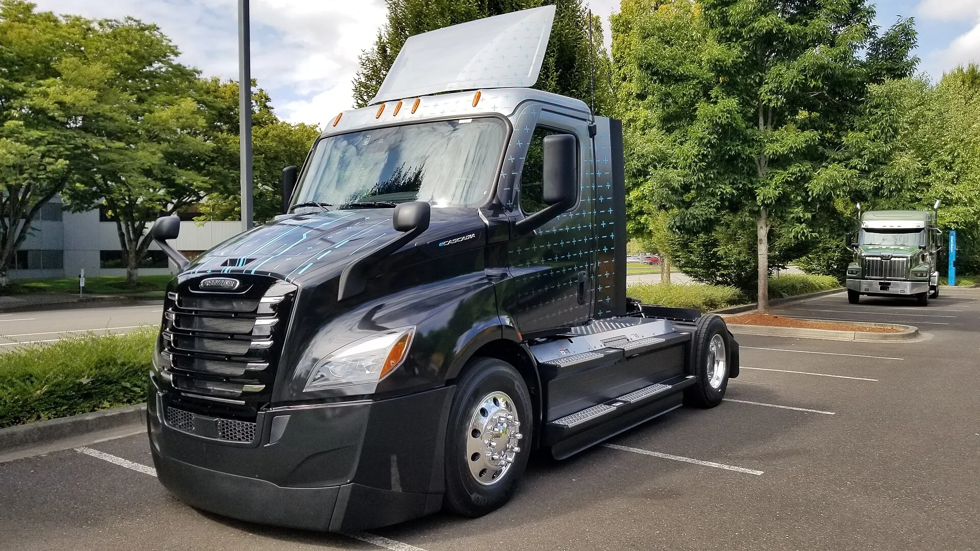 Freightliner eCascadia battery-electric Class 8 day cab truck parked in a lot