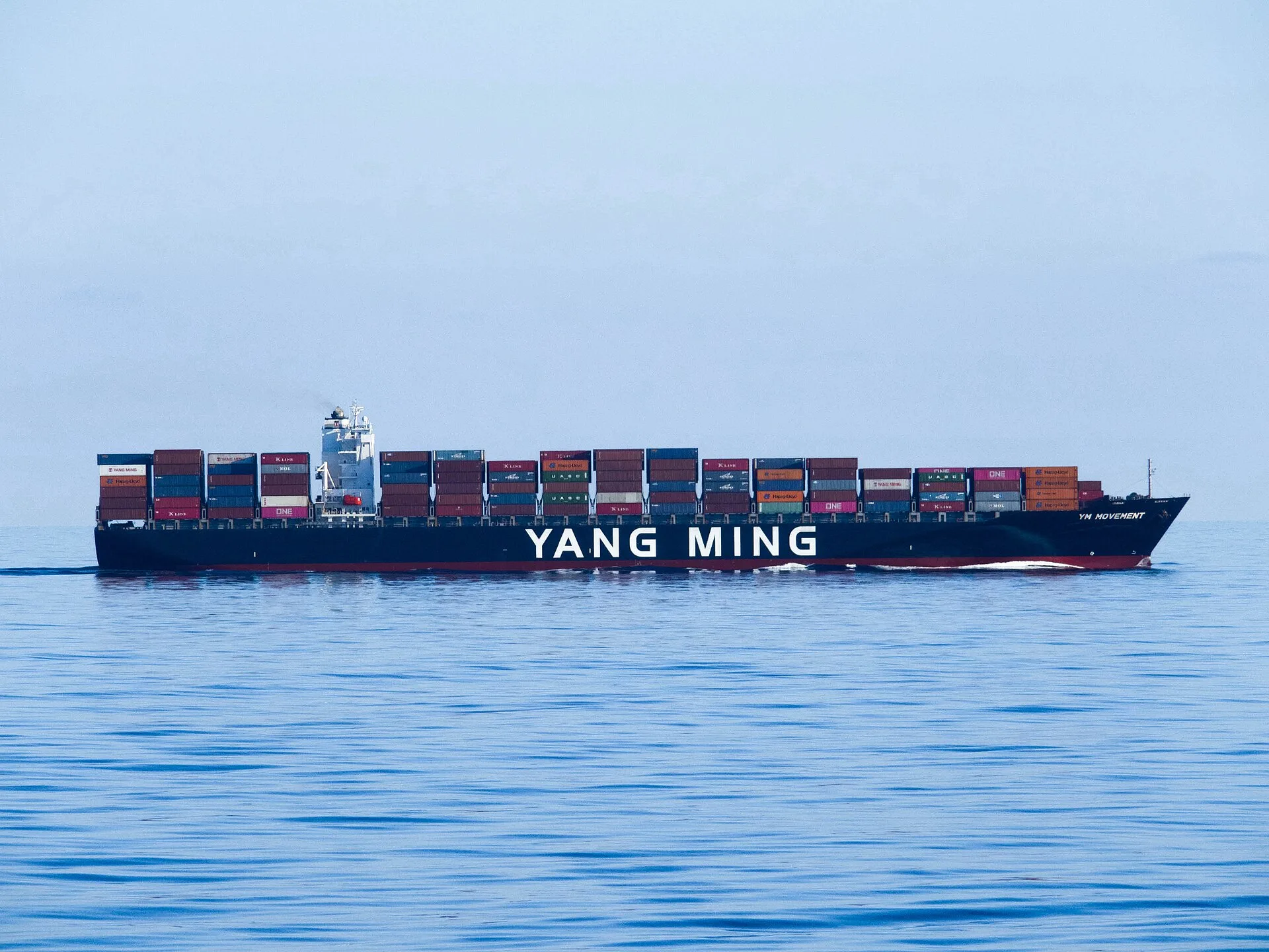 Yang Ming container ship loaded with containers under way at sea